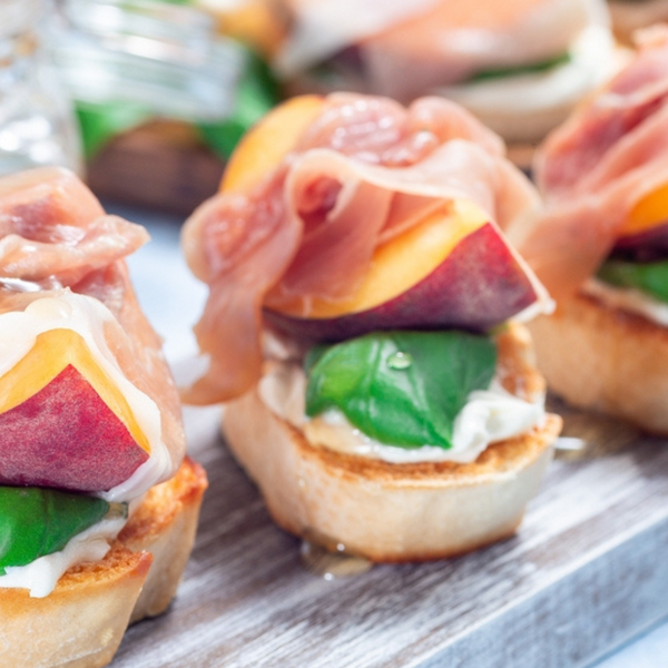 Ricotta Crostini with Hot Honey Peaches & Prosciutto