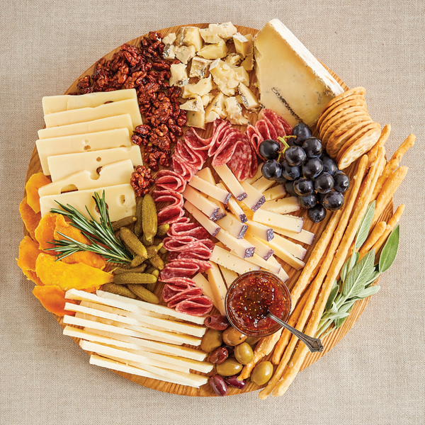 Charcuterie Board with Cheese, Nuts, Jam, Olives, Cornichons, Dried Fruit, Breadsticks