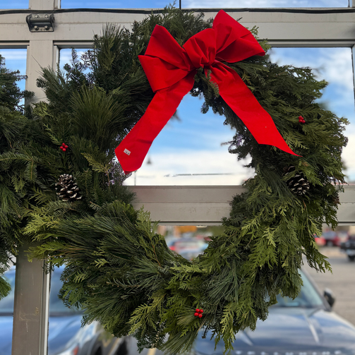 36" Wreath with red ribbon in our greenhouse