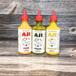 Three varieties of Aji Pepper Sauce on Wood table 